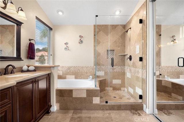 bathroom featuring tile patterned flooring, a shower stall, lofted ceiling, a bath, and vanity