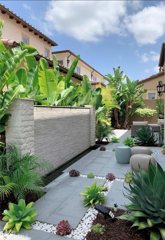 view of patio featuring fence