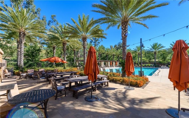 view of patio featuring a community pool