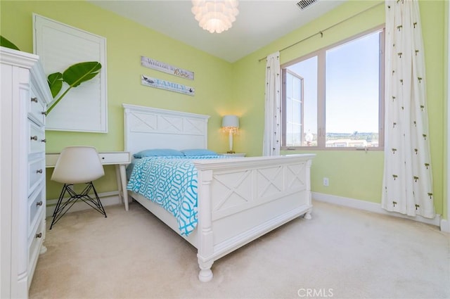 carpeted bedroom with baseboards