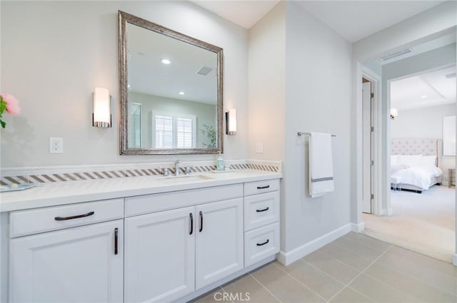 bathroom featuring recessed lighting, connected bathroom, tile patterned flooring, baseboards, and vanity