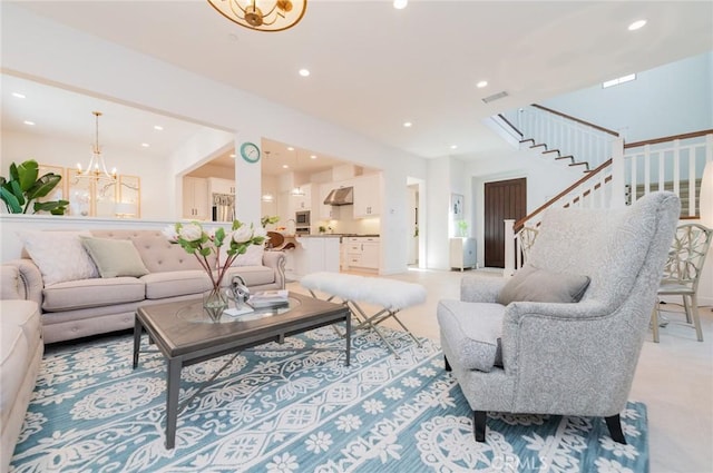 living room featuring visible vents, recessed lighting, stairway, and an inviting chandelier