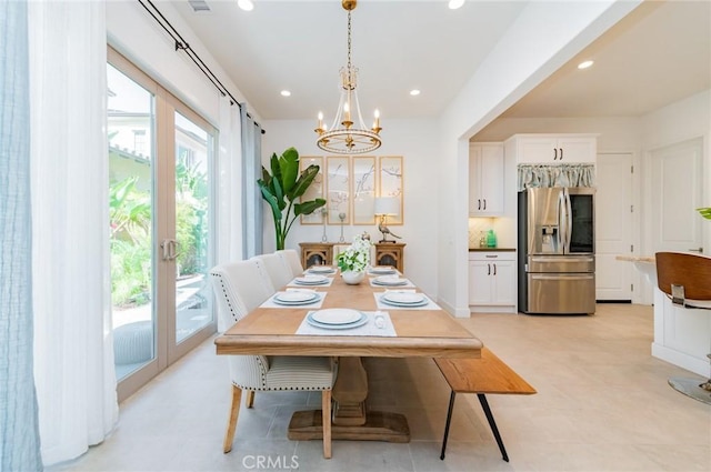 dining room with an inviting chandelier, recessed lighting, visible vents, and light floors