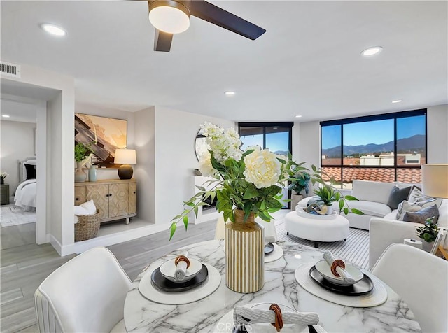 living area featuring recessed lighting, visible vents, wood finished floors, and ceiling fan