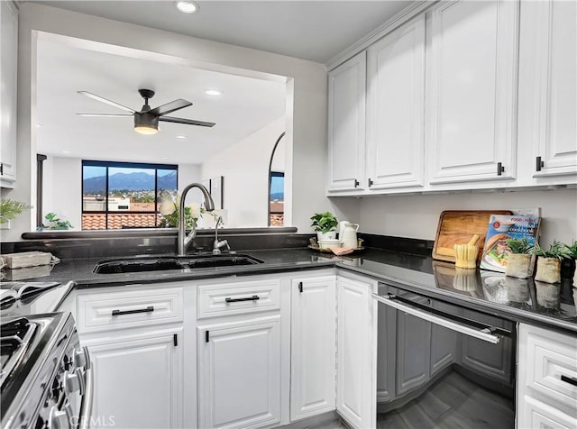 kitchen with ceiling fan, a sink, white cabinets, black dishwasher, and stainless steel gas range oven