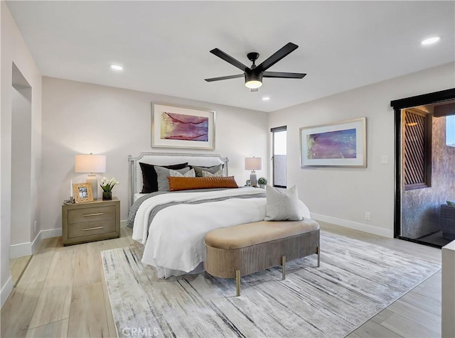 bedroom with light wood-style floors, recessed lighting, baseboards, and ceiling fan