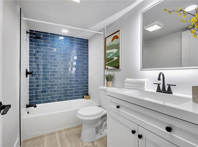 full bathroom with vanity, toilet, shower / bath combination, and wood finished floors