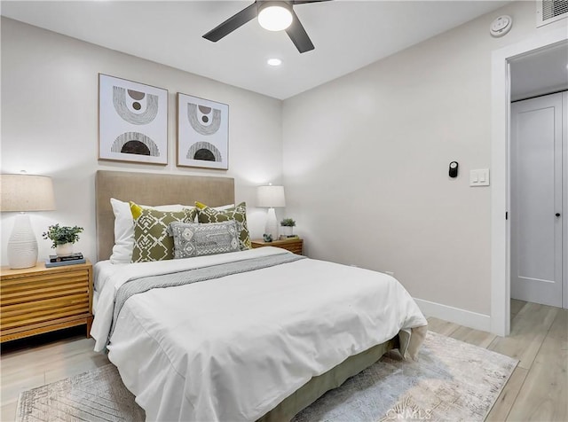 bedroom with light wood finished floors, visible vents, ceiling fan, baseboards, and recessed lighting