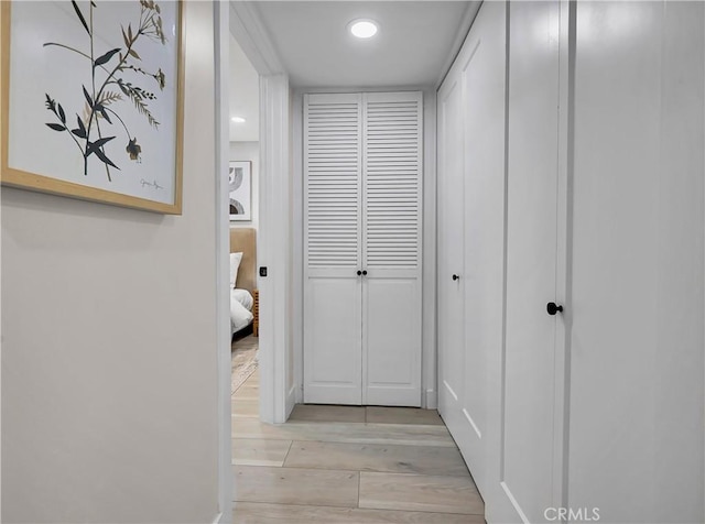 hallway featuring recessed lighting and light wood-style flooring
