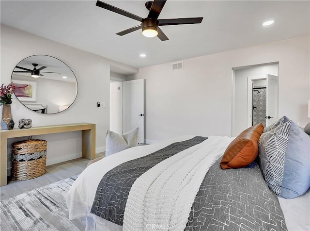 bedroom featuring visible vents, recessed lighting, baseboards, and wood finished floors