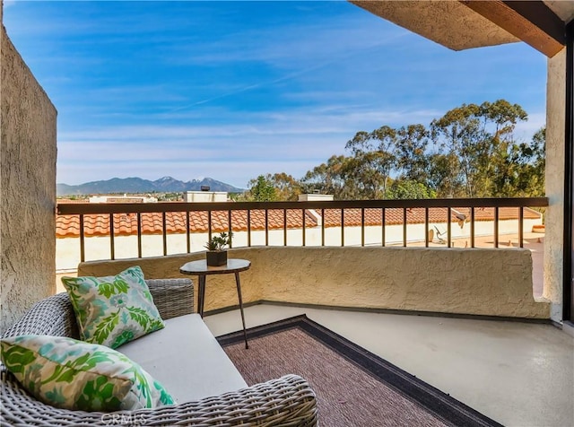 balcony featuring a mountain view