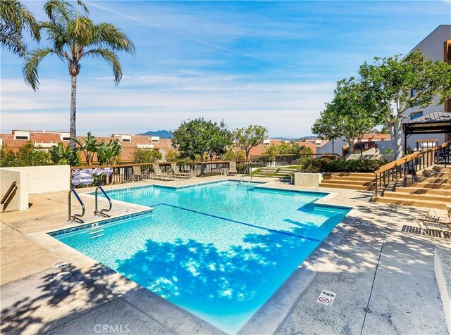 community pool featuring a patio