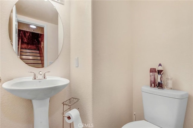 bathroom featuring toilet and a sink