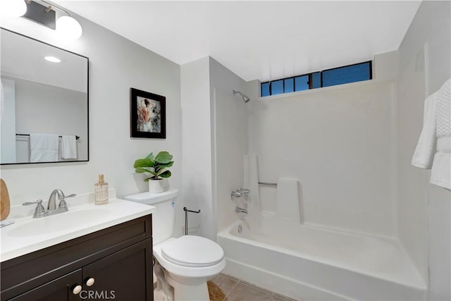 full bath featuring tile patterned flooring, toilet, vanity, and shower / bathing tub combination