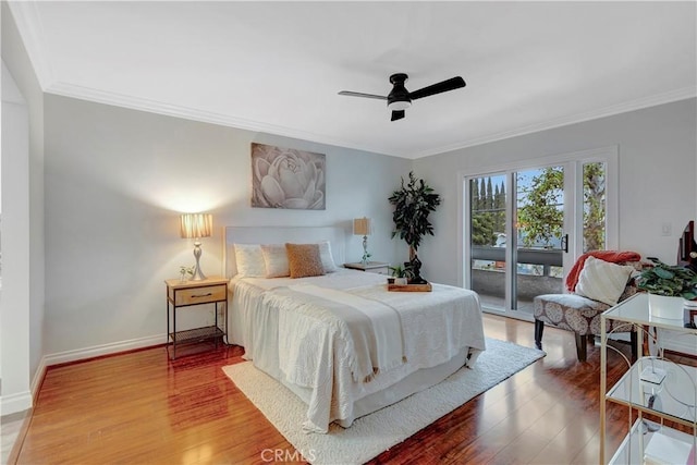 bedroom with ornamental molding, a ceiling fan, access to outside, wood finished floors, and baseboards