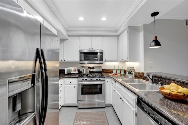 kitchen featuring a sink, ornamental molding, white cabinetry, and stainless steel appliances