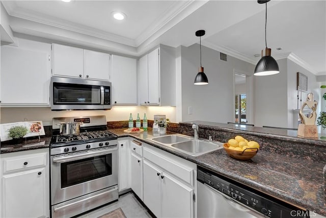 kitchen featuring a sink, crown molding, white cabinetry, and stainless steel appliances