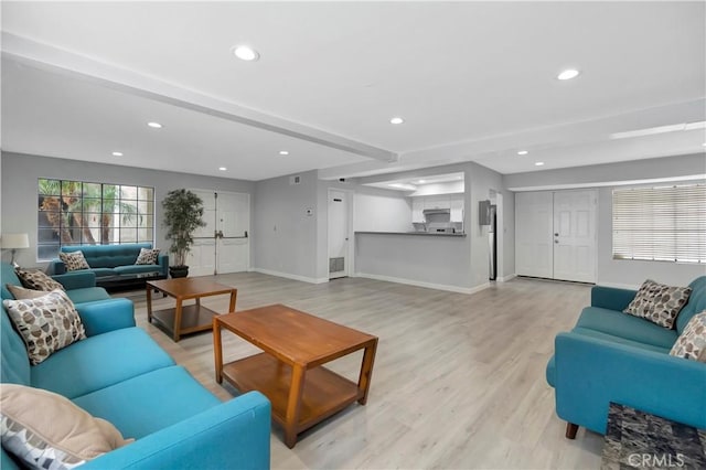 living room featuring visible vents, beam ceiling, recessed lighting, light wood-style floors, and baseboards