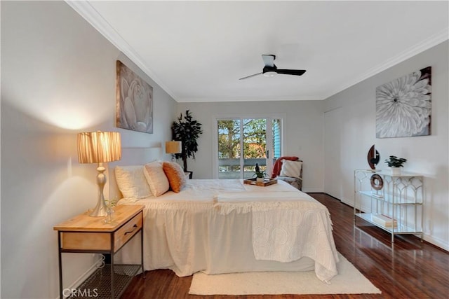 bedroom featuring ceiling fan, crown molding, baseboards, and dark wood-style flooring