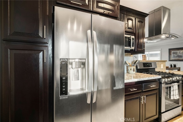 kitchen with stainless steel appliances, backsplash, dark brown cabinets, and wall chimney exhaust hood