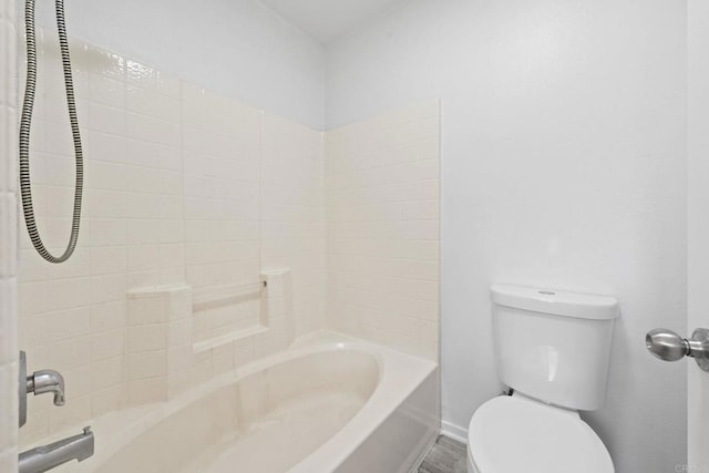 full bath featuring toilet, shower / bath combination, and baseboards