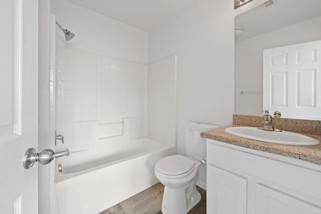 full bathroom featuring vanity, wood finished floors, toilet, and bathtub / shower combination