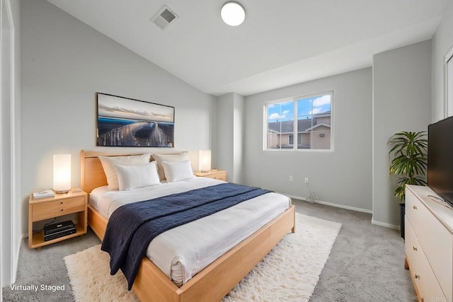 bedroom featuring light carpet, visible vents, baseboards, and lofted ceiling