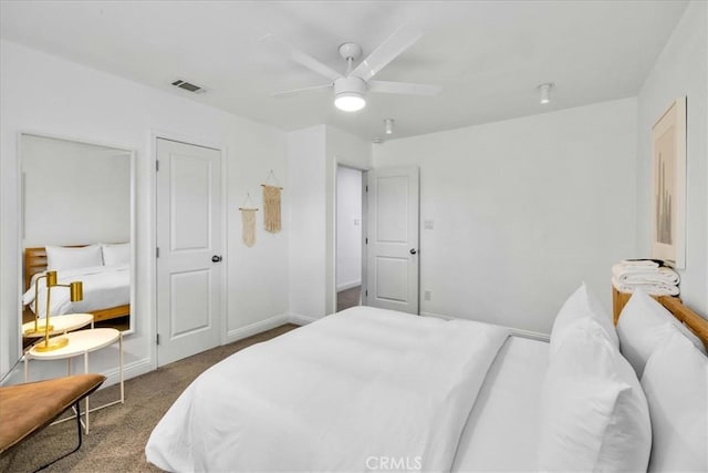 bedroom featuring baseboards, carpet flooring, a ceiling fan, and visible vents