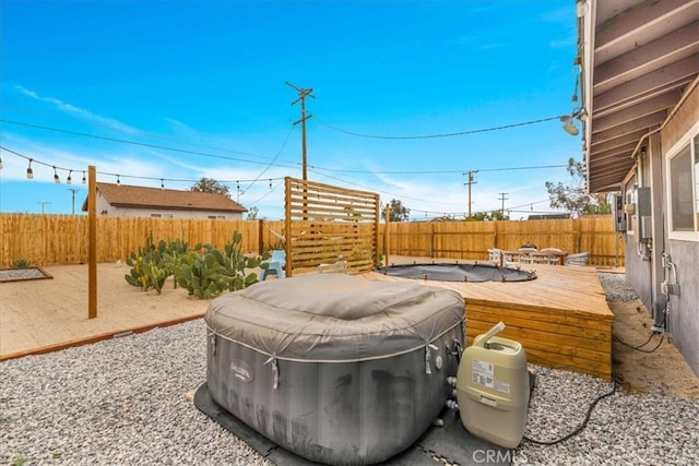 6566 El Rey Ave Unit 29, Palms, CA 92277 - view of patio featuring a fenced backyard and a wooden deck