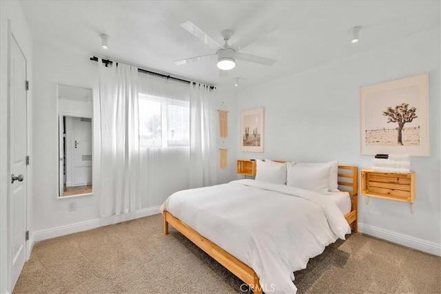 bedroom with baseboards, ceiling fan, and carpet flooring