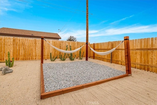 exterior space featuring a fenced backyard