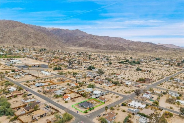 drone / aerial view with a mountain view and view of desert