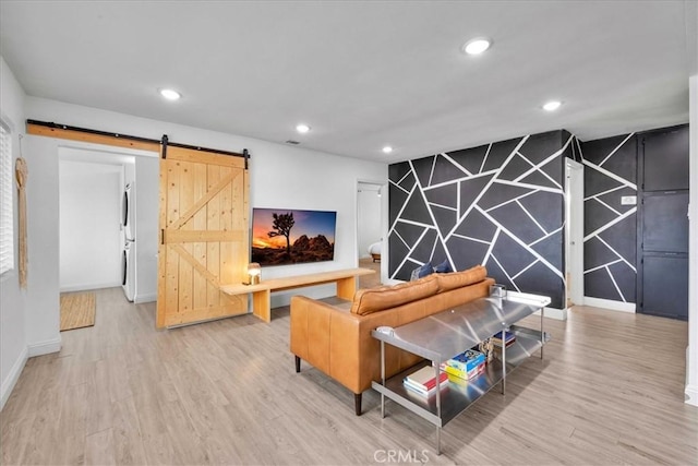 6566 El Rey Ave Unit 29, Palms, CA 92277 - living room featuring wood finished floors, recessed lighting, baseboards, and a barn door