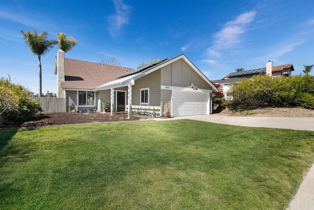 ranch-style home featuring driveway, fence, a front yard, a garage, and a chimney