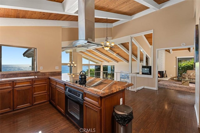 kitchen featuring wood ceiling, black appliances, a peninsula, and an inviting chandelier