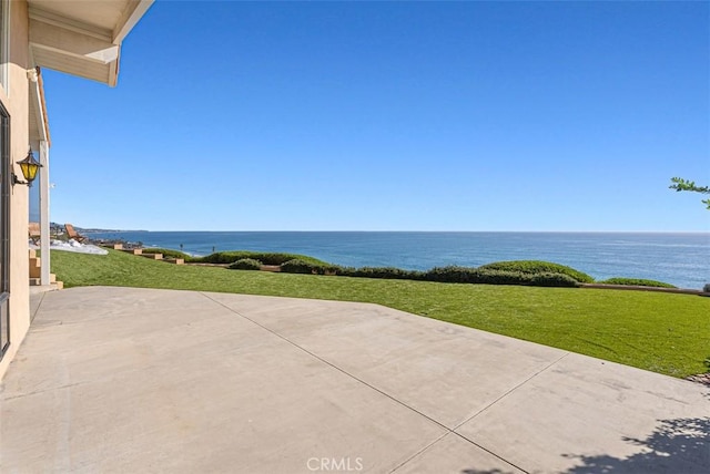 view of patio with a water view