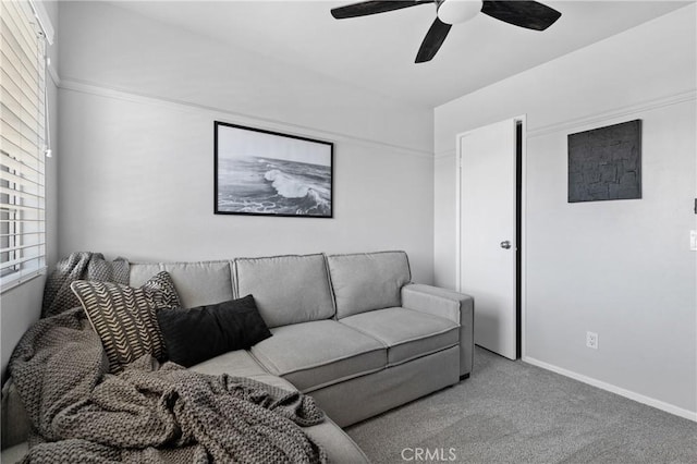 living room featuring carpet flooring, a ceiling fan, and baseboards