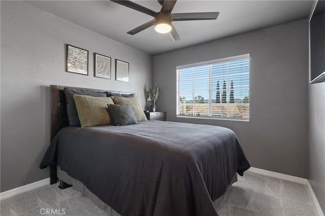 bedroom with baseboards, a ceiling fan, and carpet flooring