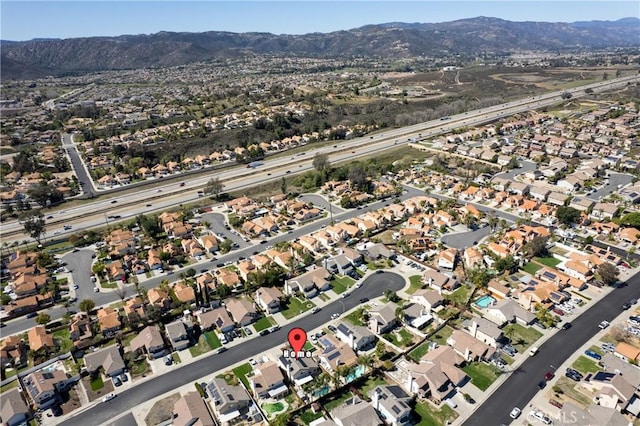 drone / aerial view featuring a mountain view and a residential view