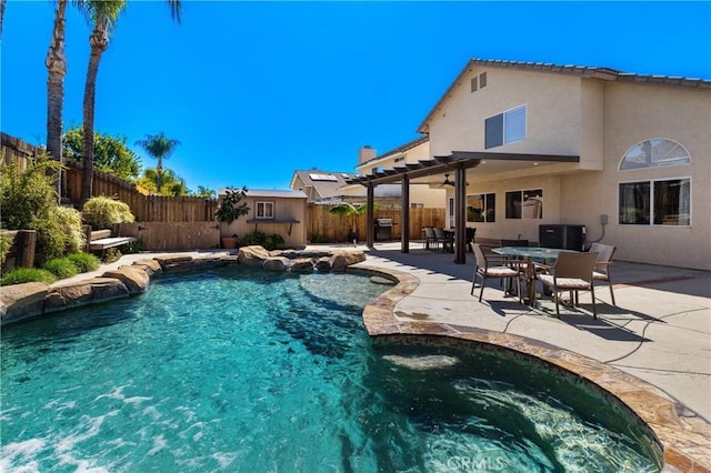 view of swimming pool featuring a fenced in pool, a patio, a fenced backyard, and a jacuzzi