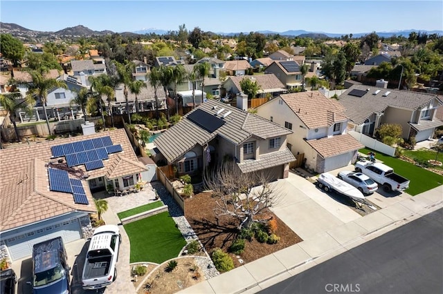 drone / aerial view featuring a mountain view and a residential view