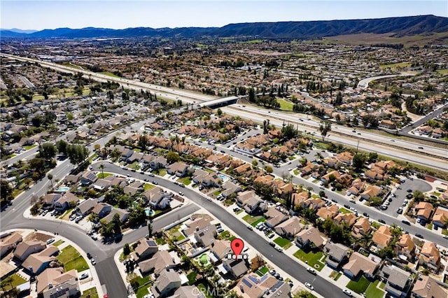 drone / aerial view with a mountain view and a residential view