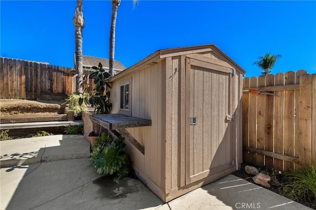 view of shed featuring a fenced backyard