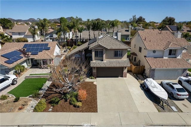 birds eye view of property with a mountain view and a residential view