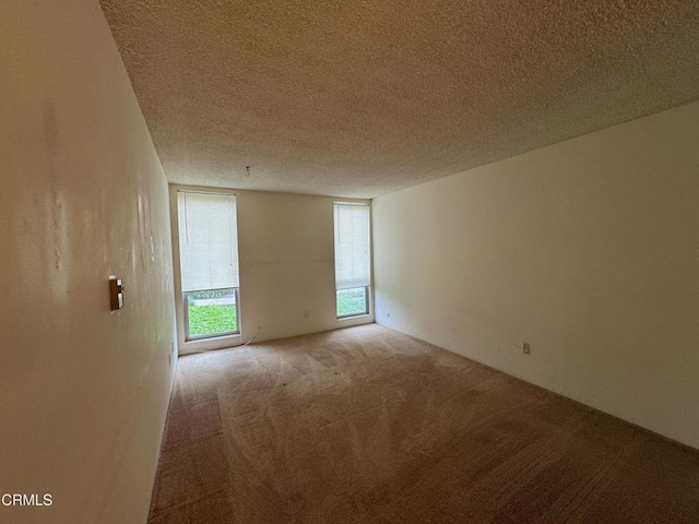 3700 Dean Dr Unit 3405, Ventura, CA 93003 - spare room with a textured ceiling and carpet floors