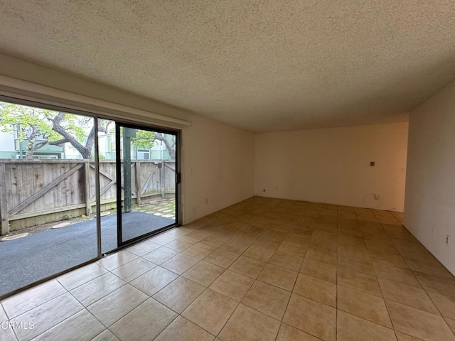 3700 Dean Dr Unit 3405, Ventura, CA 93003 - unfurnished room featuring light tile patterned floors and a textured ceiling