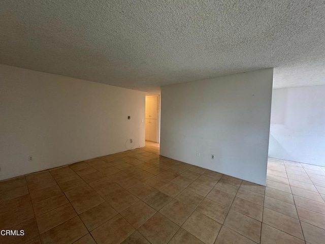 3700 Dean Dr Unit 3405, Ventura, CA 93003 - empty room featuring a textured ceiling and light tile patterned flooring