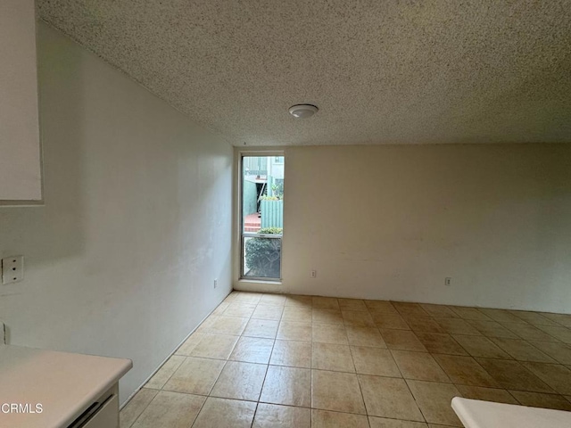 3700 Dean Dr Unit 3405, Ventura, CA 93003 - unfurnished room featuring light tile patterned floors and a textured ceiling