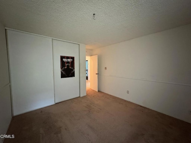 3700 Dean Dr Unit 3405, Ventura, CA 93003 - unfurnished room with a textured ceiling and carpet flooring