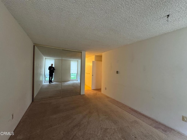 3700 Dean Dr Unit 3405, Ventura, CA 93003 - interior space with carpet floors and a textured ceiling